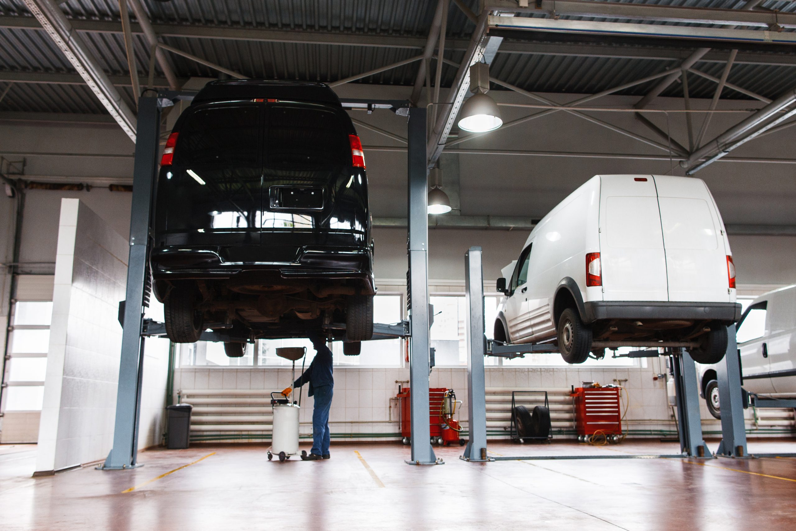 Auto service maintenance for minibuses, modern workshop for car repairing